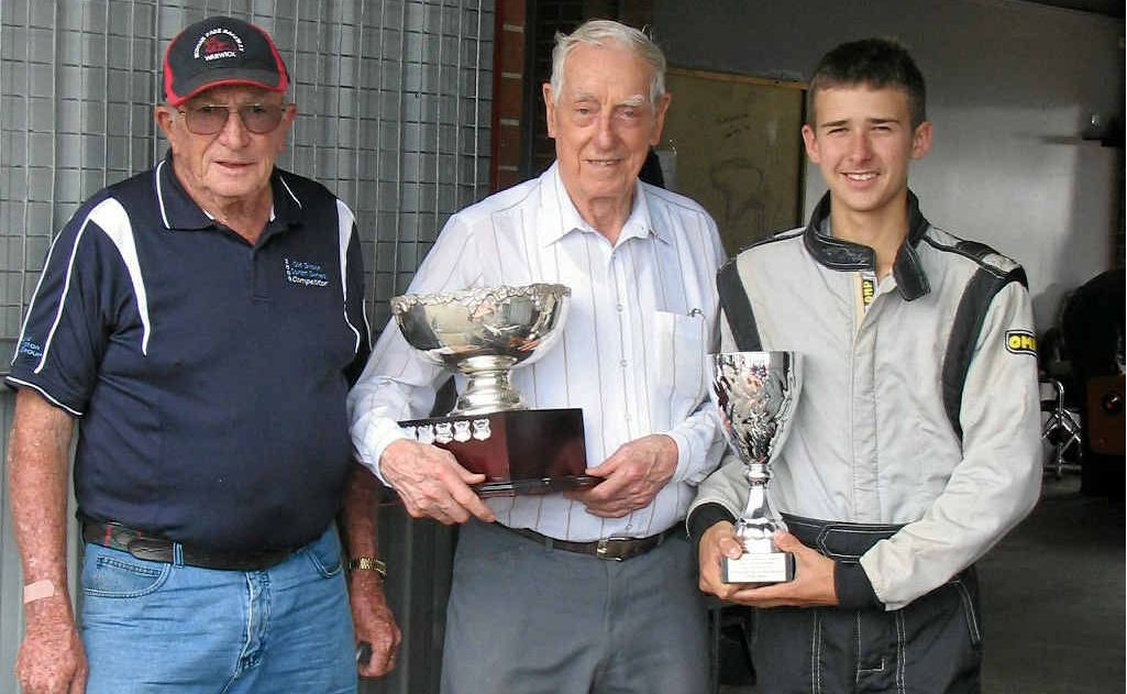 Owner Frank Marshall, trophy presenter Ron Tauranac and driver Matt Campbell at the Eastern Creek Historic Summer Meeting after a victory at Eastern Creek. Owner Frank Marshall, trophy presenter Ron Tauranac and driver Matt Campbell at the Eastern Creek Historic Summer Meeting after a victory at Eastern Creek.